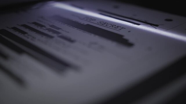 Top secret censored government file is scanned by machine to be copied or sent. Leaking information to public or press. Scanner digitizing report or document to computer system. Conspiracy and fraud 