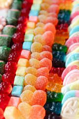 Bright and colorful assortment of gummy candies and sweets displayed in a vibrant arrangement