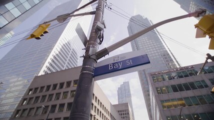 Bay Street Sign in Toronto's Financial District with Skyscrapers and Traffic Lights, Canada - Powered by Adobe