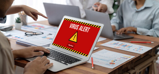 Virus warning alert on computer screen detected brisk cyber threat , hacker, computer virus and...