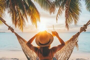 Woman relaxing in hammock with tropical cocktail at sunset beach for vacation getaway