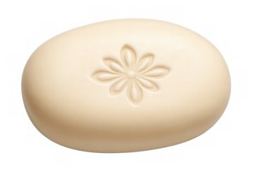 Delicate oval soap bar with flower-shaped imprint, symbolizing cleanliness and natural skincare elegance against transparent backdrop
