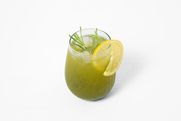Homemade tarragon soda in a glass with lemon slice, isolated on white background