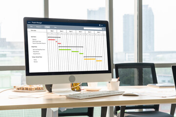 Project planning software for modish business project management on the computer screen showing...
