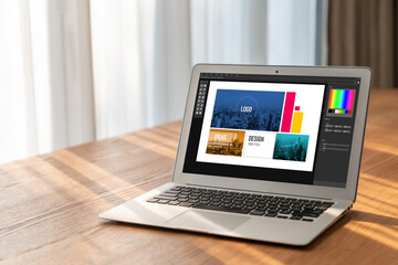 Graphic designer software for modern design of web page and commercial ads showing on the computer...