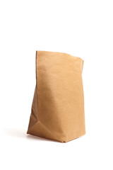 Brown paper bag stands upright on a white background, showcasing its texture and shape, ideal for packaging, storage, or eco-friendly product presentation
