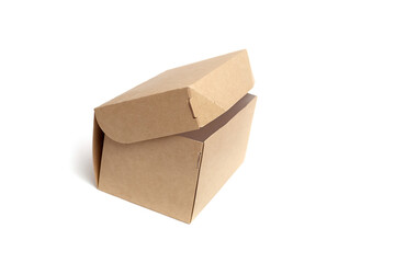 Brown cardboard box with a slanted lid, showcasing a simple and functional design, ideal for...