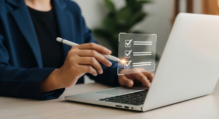 A person uses a stylus to check off items on a digital checklist displayed on a laptop screen