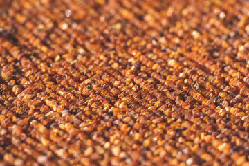 Many small pieces of raw amber of different colours in a street local traditional market