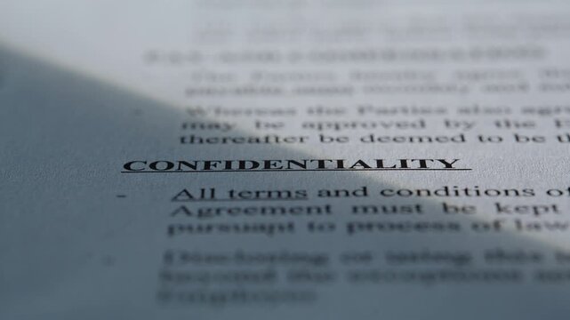 Closeup paper document confidentiality text. Macro shot security information