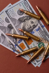 Money, cash dollars to fund weapons for war and defense against attack. Dollars for war