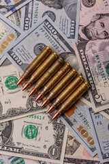Money, cash dollars to fund weapons for war and defense against attack. Dollars for war