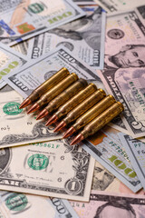 Money, cash dollars to fund weapons for war and defense against attack. Dollars for war
