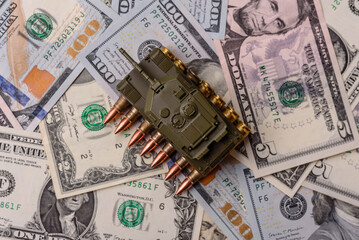 Money, cash dollars to fund weapons for war and defense against attack. Dollars for war