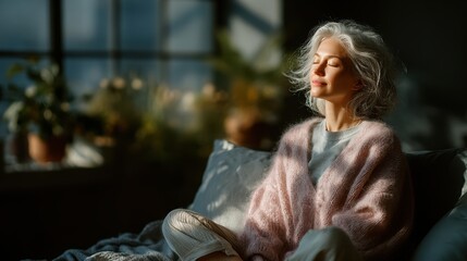 Sunlight casts a warm glow on a woman enjoying a peaceful moment in a cozy room with plants