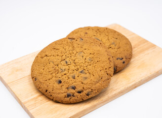 Classic Chocolate Chip Cookies on Wooden Board Side View of Desserts and Sweet Treats