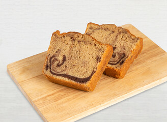 Delicious Marble Chocolate Cinnamon Cake on wooden board side view of Perfect for Dessert or Coffee Break