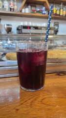 Refreshing tinto de verano beverage in a cozy cafe setting. Traditional spanish summer cocktail with wine and ice