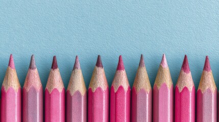 Pink Colored Pencils on Blue Background