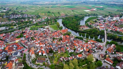 Aerial panoramic view around the old town of the city Lauffen on a cloudy spring noon in Germany.