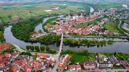 Aerial panoramic view around the old town of the city Lauffen on a cloudy spring noon in Germany.