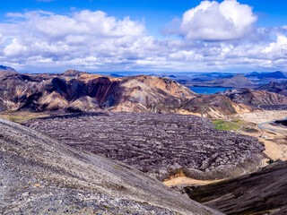 A lava field in Landmannalaugar colored mountains of Iceland