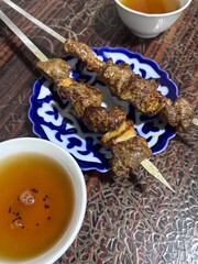 Kebab on plate and tea hot meal