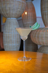 apple martini cocktail in a stylish and bohemian restaurant