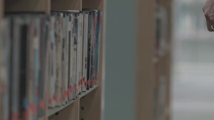 browsing movies on DVD shelf