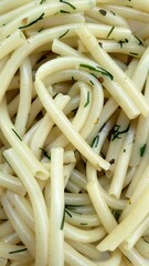 Close-up of fresh and tasty white pasta with green herbs, a culinary delight showcasing simplicity...