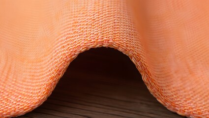 Close up of orange woven fabric texture background for design and textile industry use