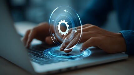 Hands typing on laptop with gear icon overlay representing settings or customization options on screen