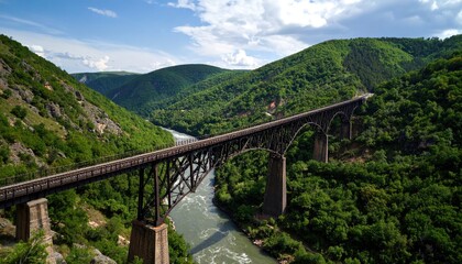 Fototapeta premium A long metal bridge spans a valley