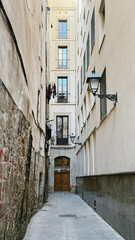 Charming Narrow Alleyway in Barcelona: A Glimpse of Everyday Life Among Historic Buildings and...