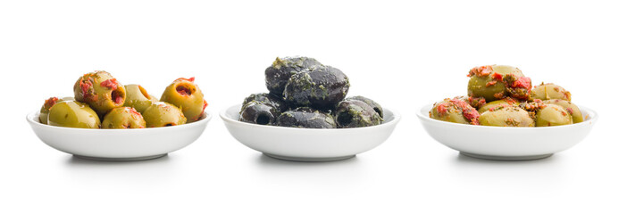 Tapas. Flavored pickled olives in bowl isolated on white background.
