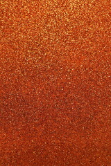 Blurred shiny orange glitter texture background