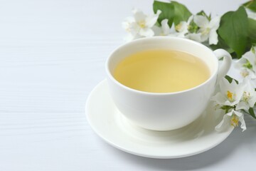 Homemade jasmine tea and arabian jasmine flower on white background
