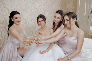 Bridesmaids celebrate with champagne toast before wedding ceremony in elegant setting