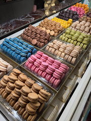 A big pile of macarons in a store