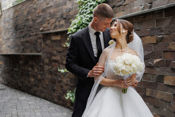Couple shares intimate moment in romantic outdoor setting during wedding ceremony