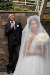 Groom waiting for bride in elegant wedding setting with soft focus on couple's love