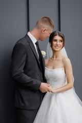 Couple shares a tender moment outdoors during their wedding ceremony celebration