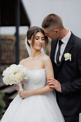 Couple shares a tender moment during outdoor wedding ceremony