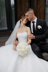 Couple sharing a romantic moment on their wedding day outdoors