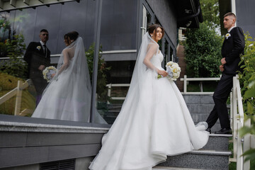 Couple celebrating wedding day at outdoor terrace with reflections