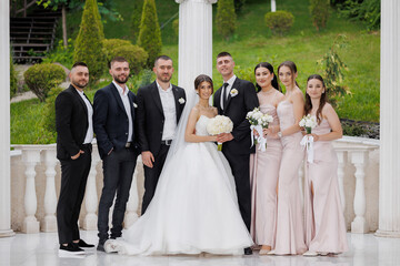 Couples celebrate wedding with friends in a beautiful outdoor venue during daytime