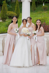 Beautiful bridal party celebrates joyful wedding day in outdoor garden setting