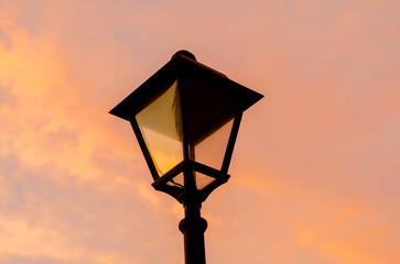 Obraz premium Close up, retro street lamp at sunset.