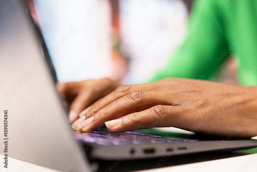 Poster freelancer in home office browsing internet on notebook, researching information online. close up of