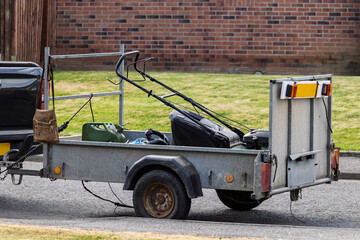 Gardening business trailer with lawnmower and tools
